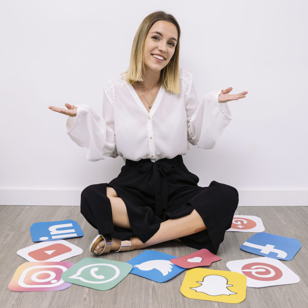 businesswoman sitting floor with social media icons shrugging Our Services