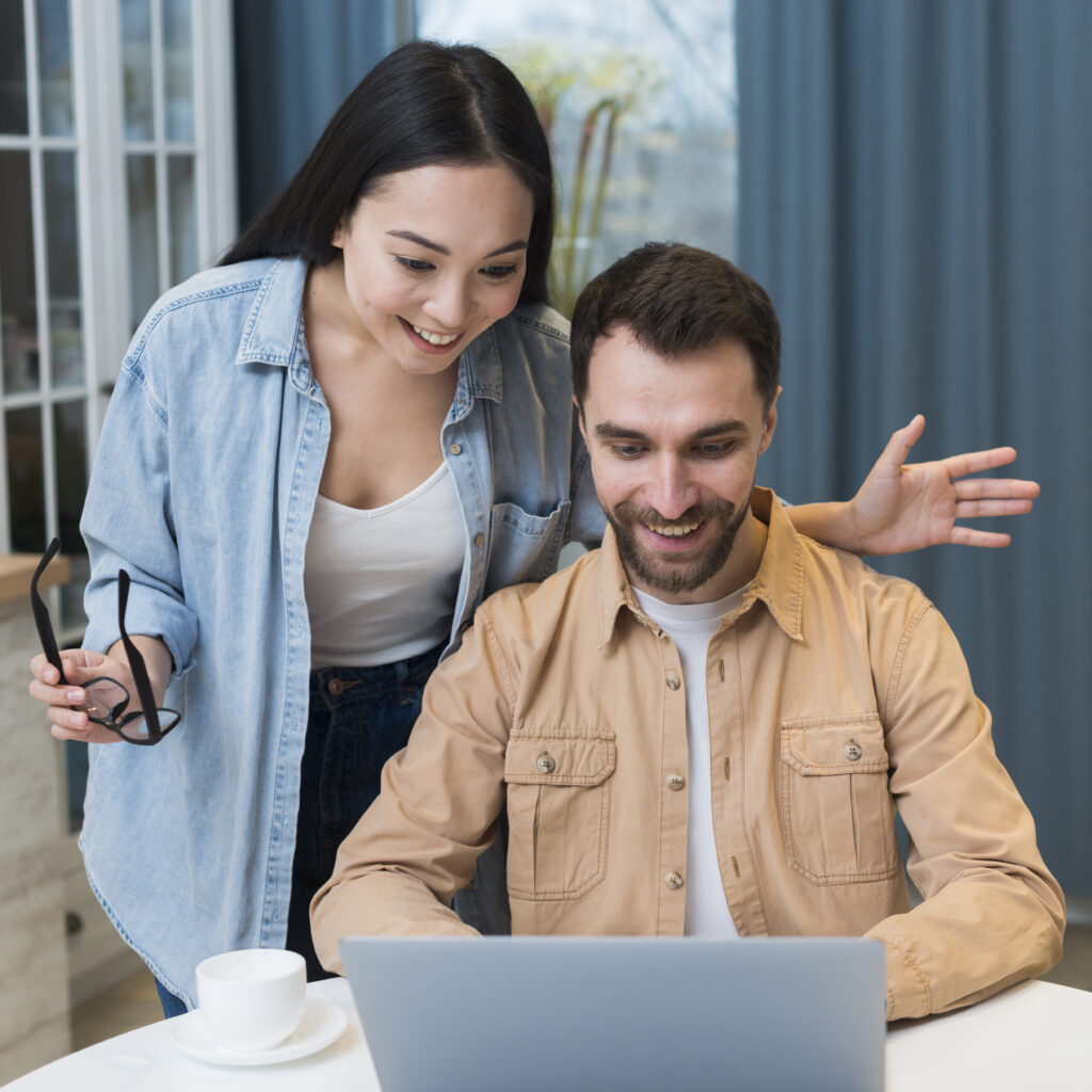 smiley couple shopping online laptop Website Development